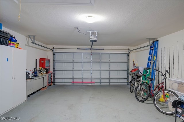 garage featuring a garage door opener