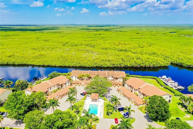 birds eye view of property featuring a water view and a residential view