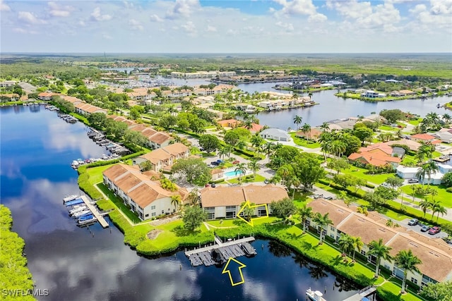 birds eye view of property with a residential view and a water view