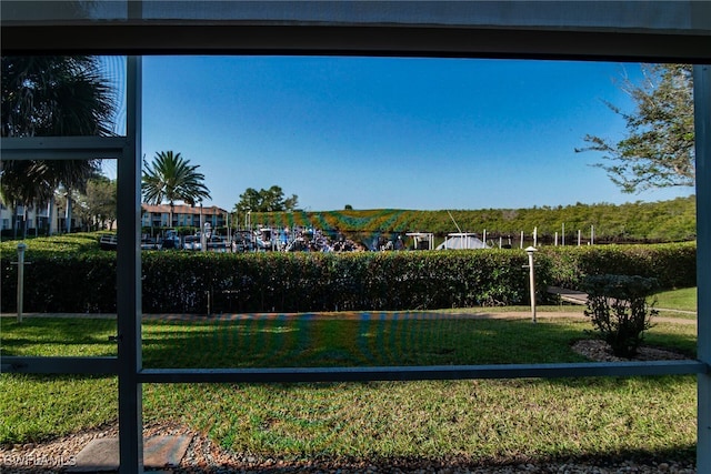 view of property's community with a lawn