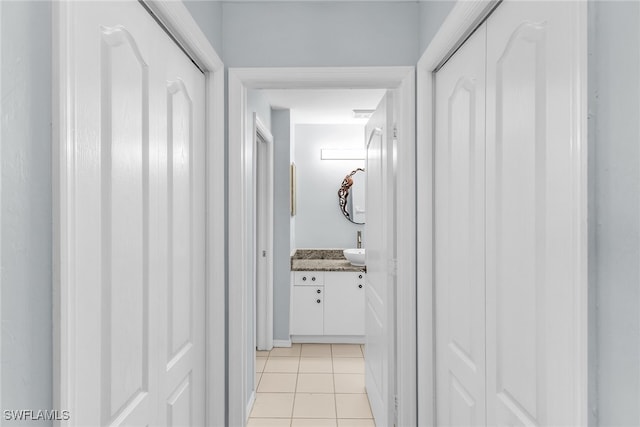 corridor with light tile patterned floors