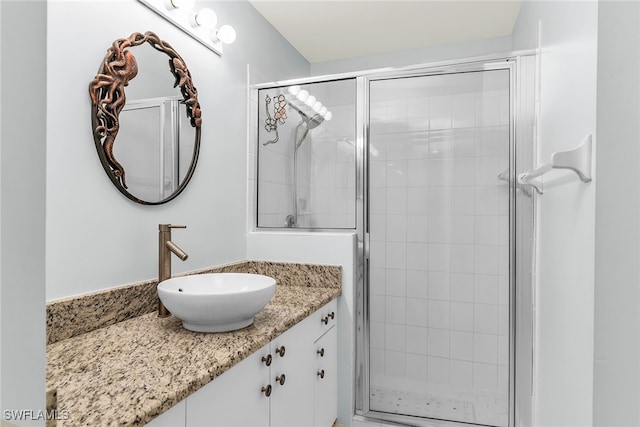 bathroom featuring vanity and a stall shower