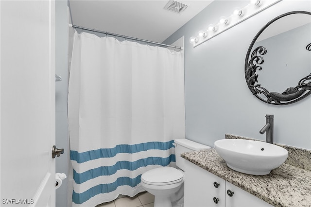 bathroom with visible vents, toilet, a shower with curtain, tile patterned floors, and vanity