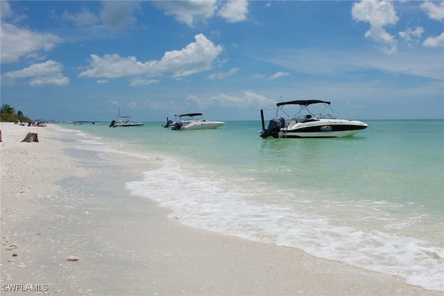 view of water feature with a beach view