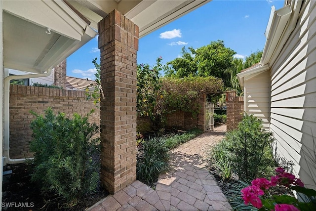 view of patio / terrace featuring a gate and fence