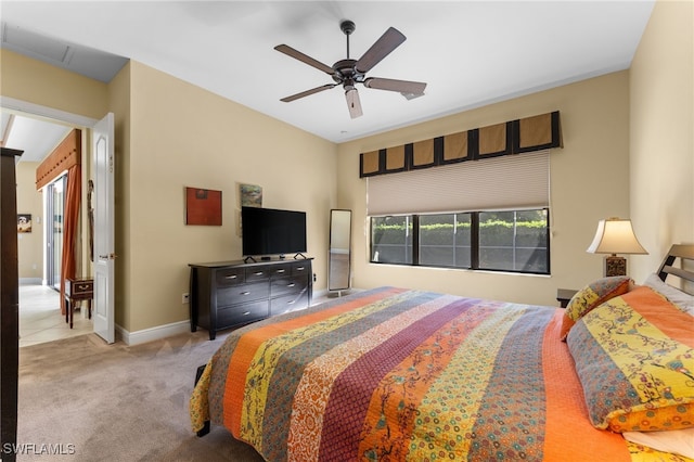 bedroom with ceiling fan, baseboards, and carpet floors