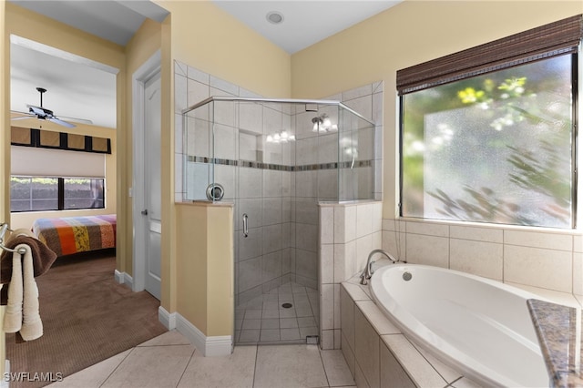 ensuite bathroom featuring tile patterned flooring, a garden tub, a ceiling fan, and a shower stall