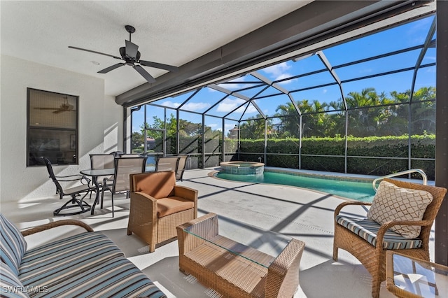 view of patio / terrace with outdoor lounge area, a lanai, a pool with connected hot tub, and ceiling fan
