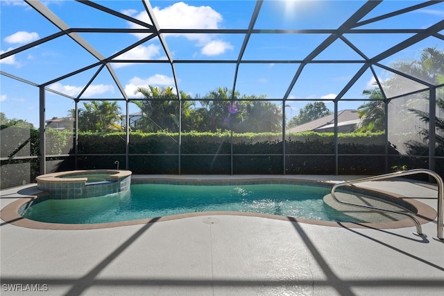 view of swimming pool featuring a patio, a lanai, and a pool with connected hot tub