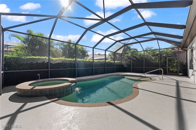 view of pool with glass enclosure, a patio, and a pool with connected hot tub