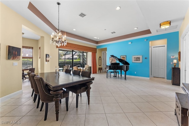 dining space with an inviting chandelier, light tile patterned floors, baseboards, and visible vents