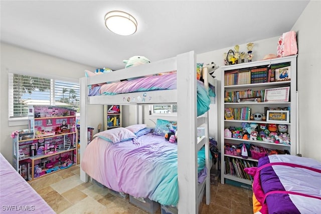 bedroom with stone finish flooring