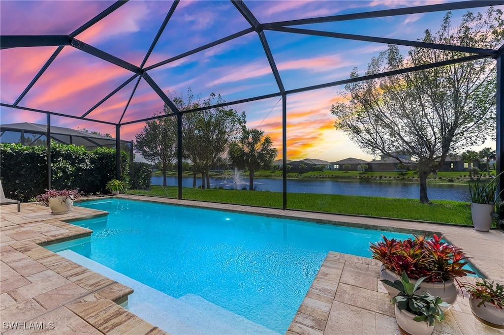 8888 Redonda Dr, Naples, FL 34114 - pool at dusk with a water view, a lanai, an outdoor pool, and a patio area