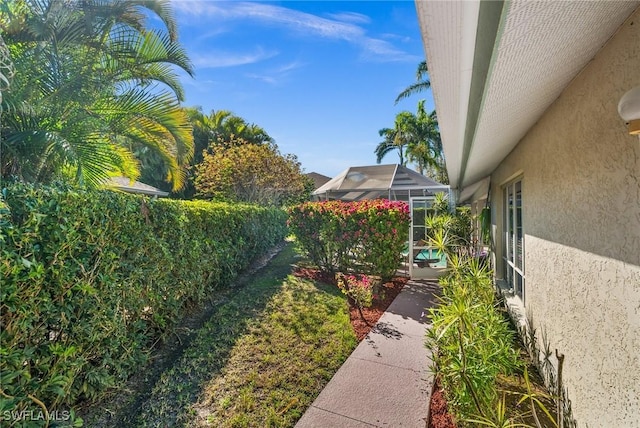 view of yard featuring a lanai