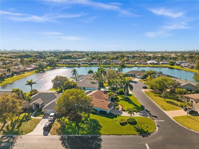 bird's eye view featuring a residential view and a water view