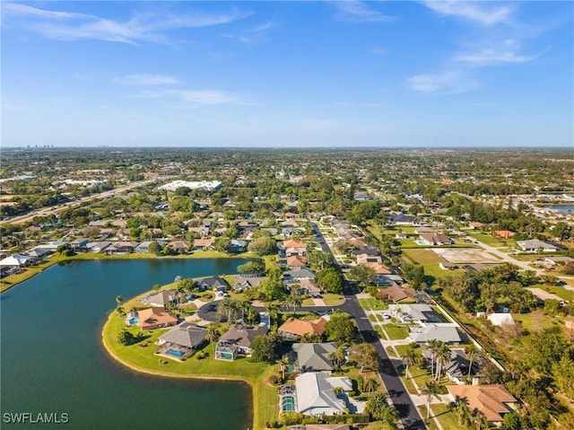 bird's eye view featuring a residential view and a water view