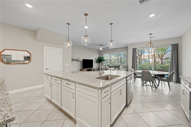 kitchen with visible vents, ceiling fan, light tile patterned floors, appliances with stainless steel finishes, and a sink