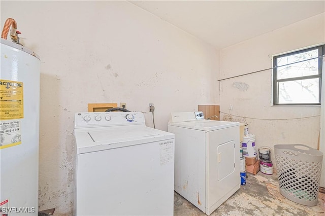 laundry area with water heater, laundry area, and washer and dryer