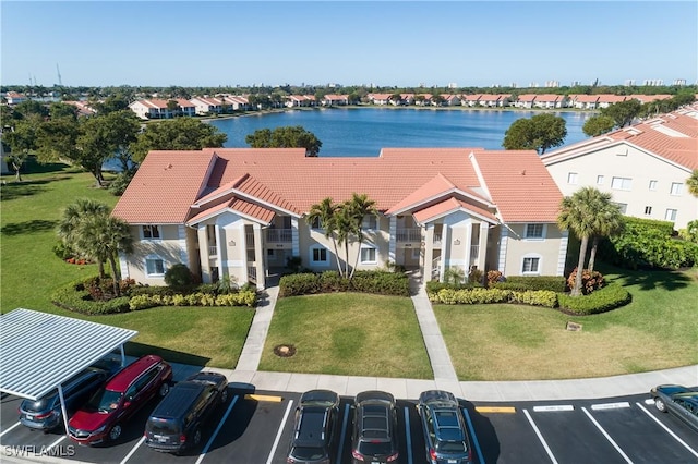 bird's eye view with a residential view and a water view