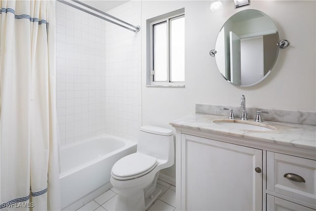 bathroom featuring tile patterned flooring, toilet, vanity, and shower / tub combo