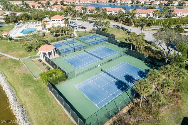 drone / aerial view featuring a residential view and a water view