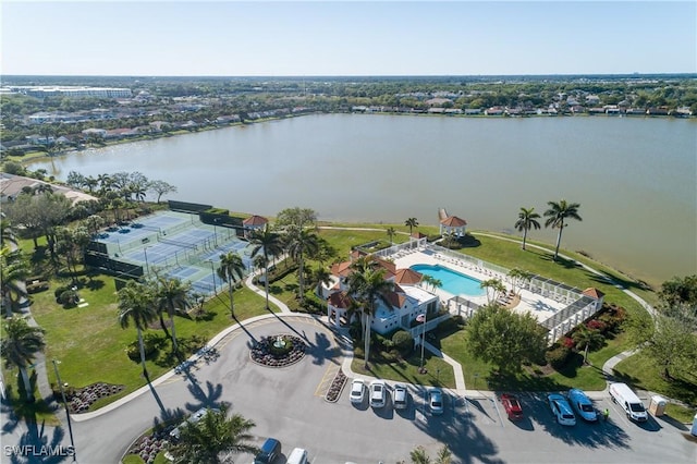 birds eye view of property with a water view