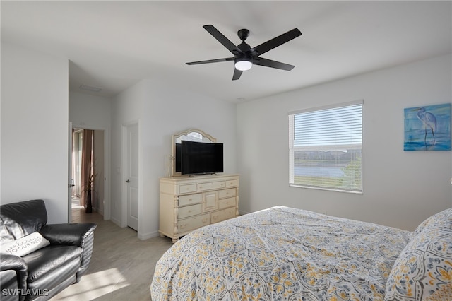 bedroom with a ceiling fan and baseboards