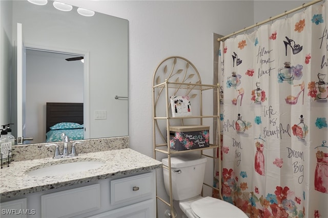 ensuite bathroom with vanity, ensuite bath, toilet, and a shower with curtain