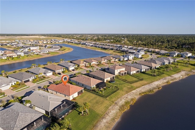 bird's eye view with a residential view and a water view