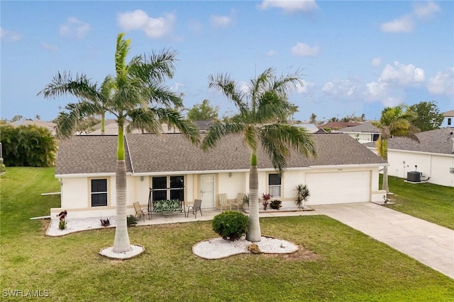 ranch-style house with stucco siding, a front lawn, cooling unit, concrete driveway, and an attached garage