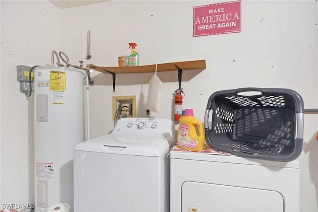 laundry area featuring water heater, laundry area, and washer and dryer