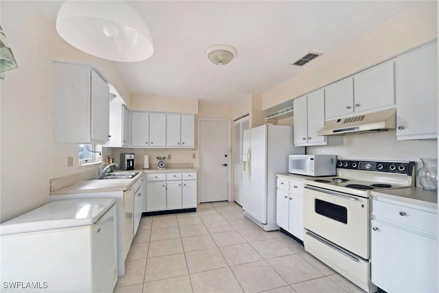 kitchen with visible vents, under cabinet range hood, white appliances, white cabinetry, and a sink