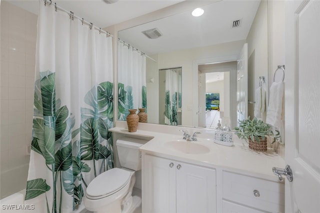 bathroom featuring visible vents, toilet, shower / bath combination with curtain, and vanity
