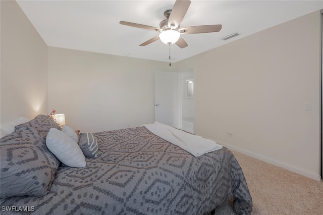 carpeted bedroom featuring visible vents, ceiling fan, and baseboards