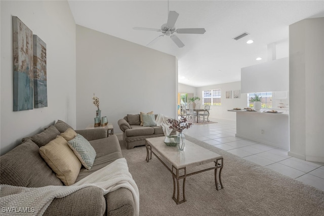 living area featuring recessed lighting, visible vents, a ceiling fan, light tile patterned flooring, and lofted ceiling