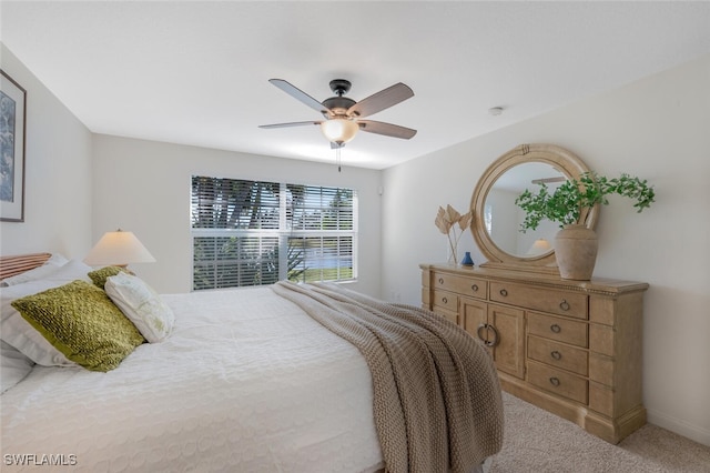 bedroom with baseboards, light carpet, and ceiling fan