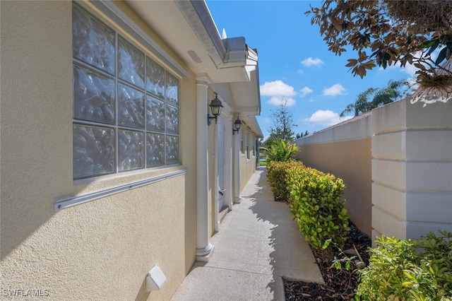 view of side of property featuring stucco siding