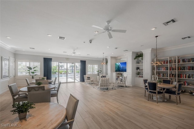 dining area featuring a wealth of natural light, visible vents, and ceiling fan