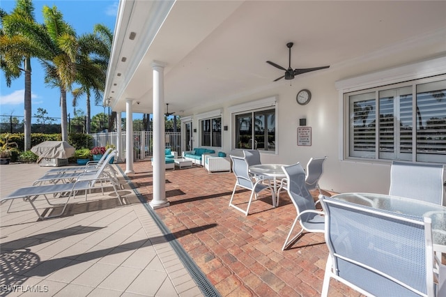 view of patio with ceiling fan, fence, outdoor dining area, and outdoor lounge area