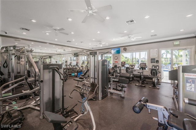 gym with visible vents, ornamental molding, and ceiling fan