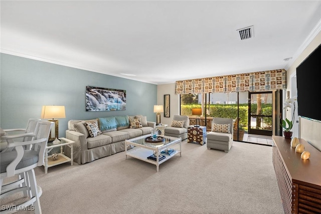 carpeted living room featuring visible vents and crown molding