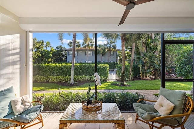 sunroom featuring ceiling fan