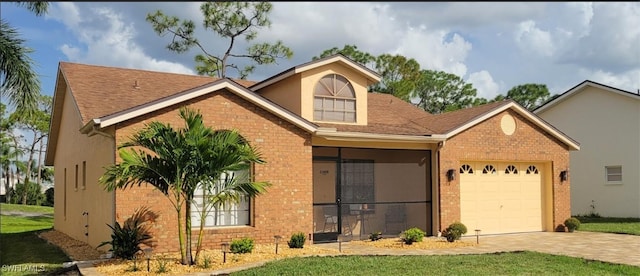 view of front of property featuring a garage, brick siding, and driveway