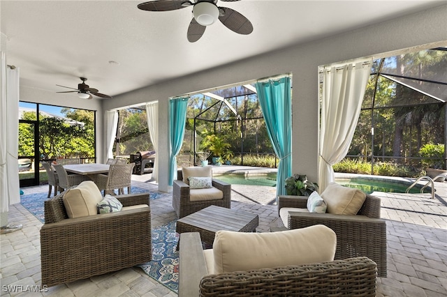 view of patio / terrace featuring a ceiling fan, an outdoor living space, an outdoor pool, outdoor dining area, and a lanai