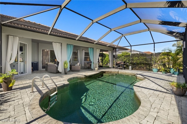 pool with an outdoor living space and a patio area