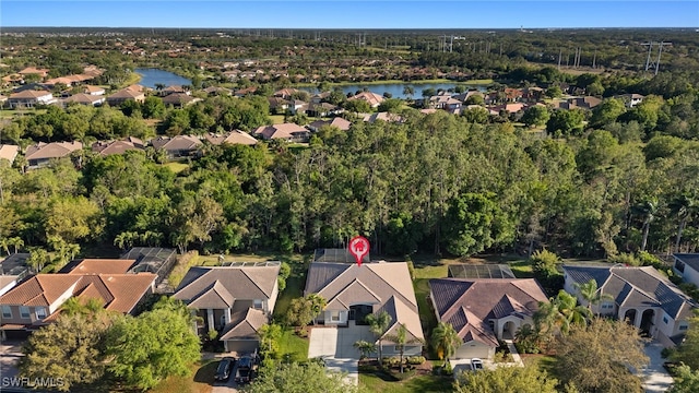 bird's eye view with a forest view, a residential view, and a water view