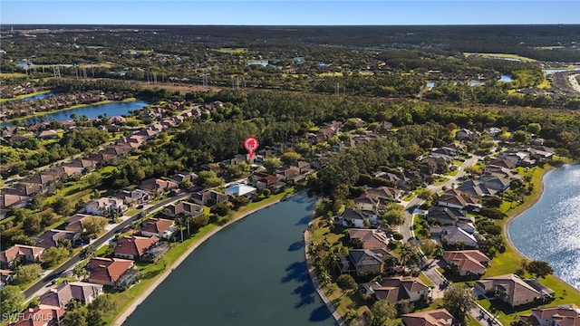 aerial view with a water view and a residential view