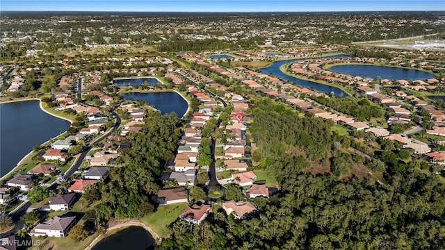 bird's eye view featuring a residential view and a water view