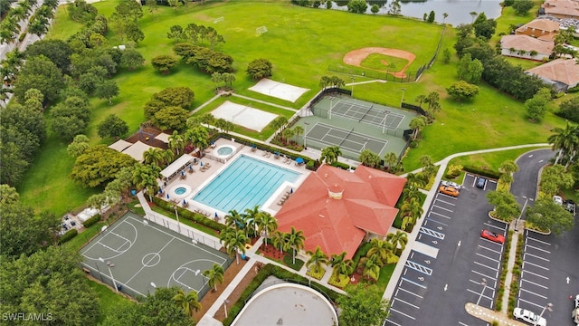 birds eye view of property with a water view