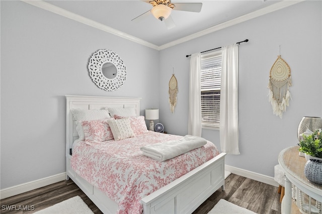 bedroom featuring dark wood-type flooring, crown molding, baseboards, and ceiling fan